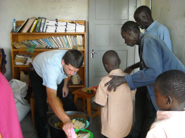Each orphan and guardian is served a generous portion of meat, potatoes, vegetables, and ugali